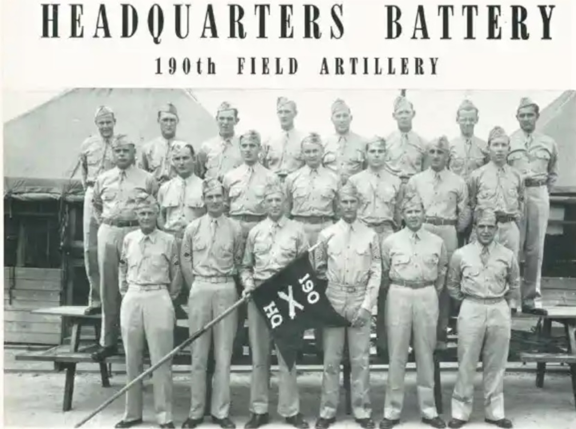 Officers of Headquarters and Headquarters Battery, 190th Field Artillery pose for a photograph at Camp Shelby, Mississippi, in 1941.