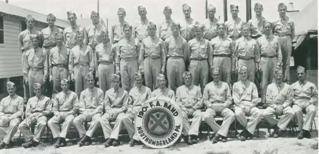 Members of the 190th Field Artillery Band pose for a photograph at Camp Shelby, Mississippi, in 1941.