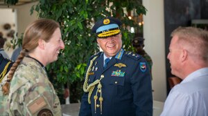 Lt. Gen. Colin Barry, Zambia Air Force commander and Col. Beth Lane, U.S. Air Forces in Europe - Air Forces Africa International Affairs division chief, speaks with members of the hotel staff after opening the ceremony at the African Partnership Flight 2023 June 5, 2023, at Lusaka, Zambia. APF serves as an opportunity to open dialogue between air force leaders across the continent, identify opportunities for the U.S. to assist African partners, and implement collective solutions. (U.S. Air Force photo by TSgt. Armando A. Schwier-Morales)