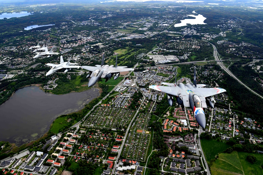 Planes fly in formation during an exercise.