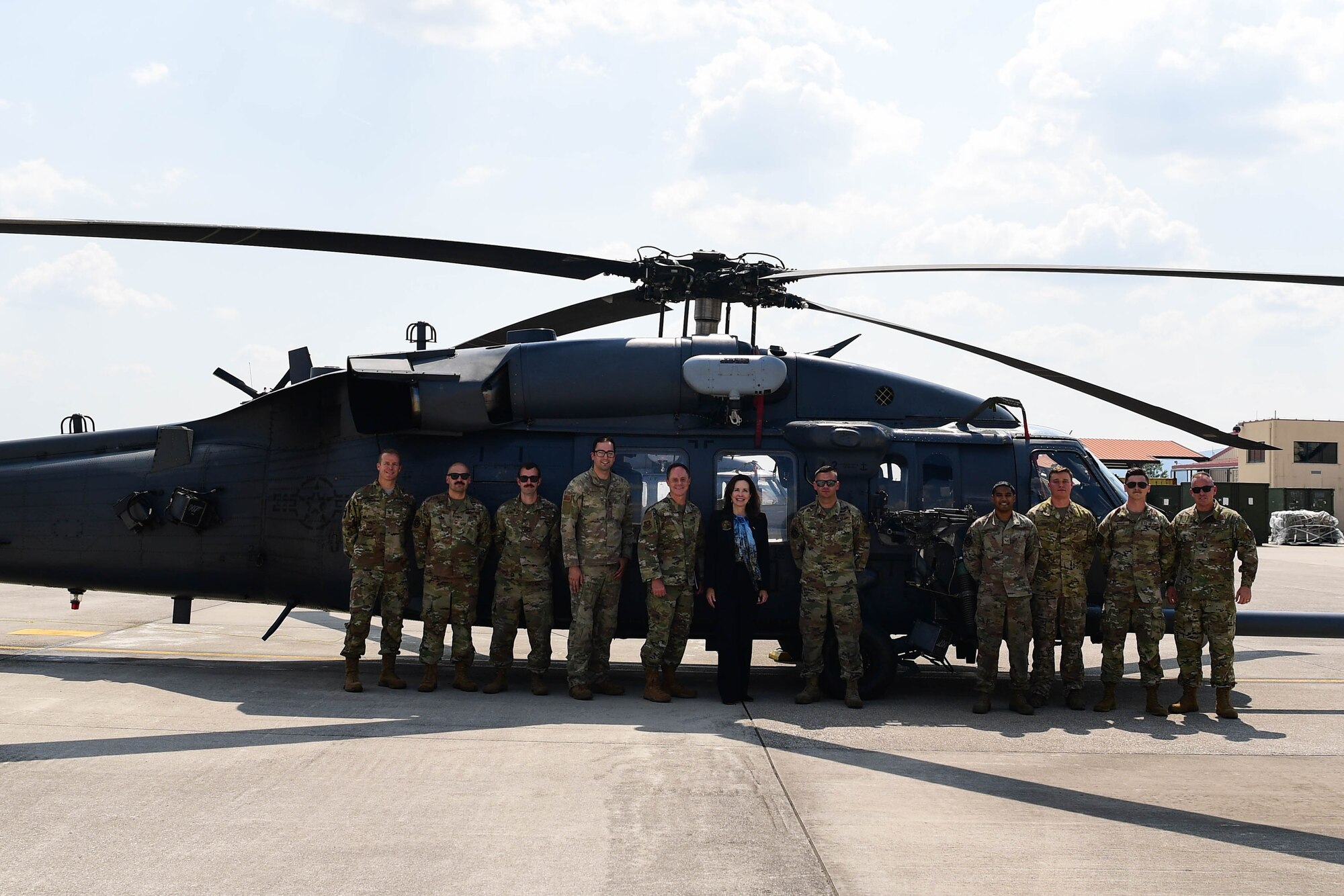 Jamie Harpootlain, U.S. Ambassador to the Republic of Slovenia, poses for a photo with base leadership at Aviano Air Base, Italy, May 1, 2023.