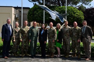 Jamie Harpootlain, U.S. Ambassador to the Republic of Slovenia, poses for a photo with base leadership at Aviano Air Base, Italy, May 1, 2023.