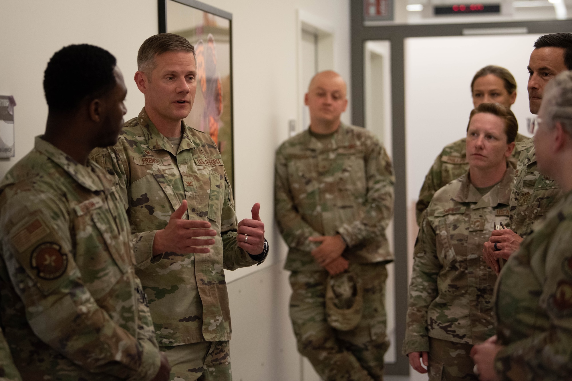U.S. Air Force Col. Peter French, 52nd Medical Group Commander, discusses the current state and the future of the newly established wing clinic, with Third Air Force command chief Stephanie Cates and members of Spangdahlem leadership