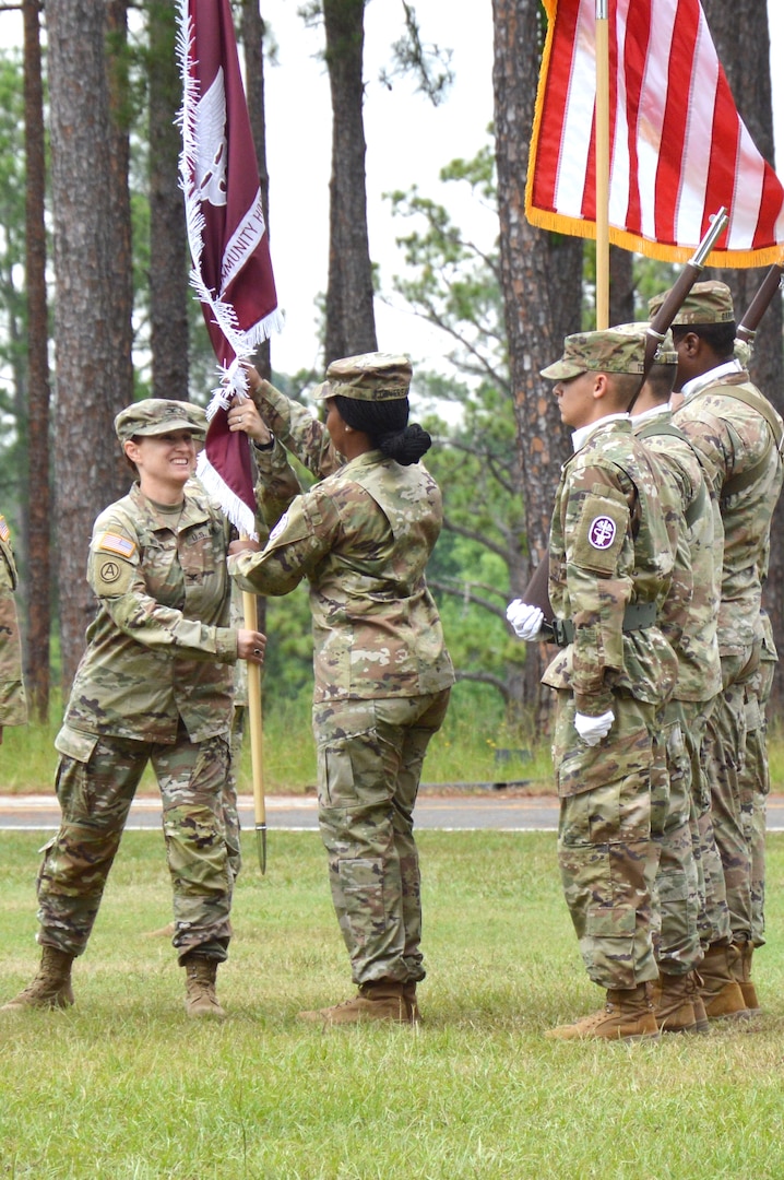 Col. Wilma passes the BJACH colors back to the CSM for safe keeping.