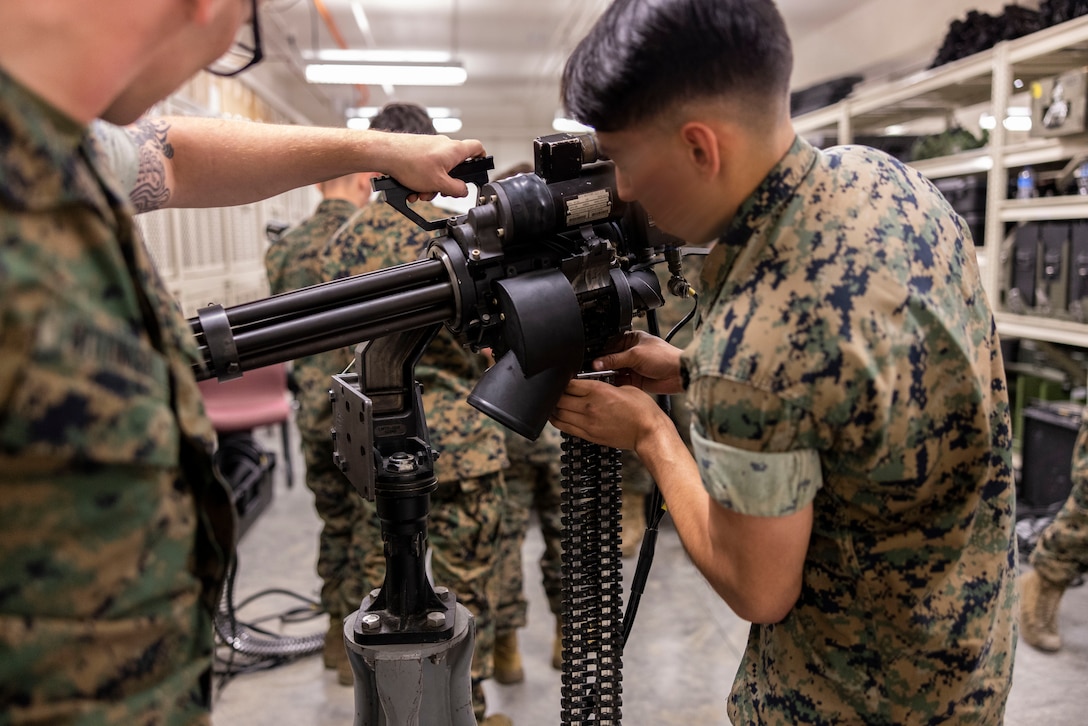 Marines from Marine Forces Special Operations Command and the Fleet Marine Force assemble a M134 Minigun during the MARSOF Ordnance portion of Multi-Discipline Logistics Operations Course at Camp Lejeune, North Carolina, March 20, 2023. MDLOC is the final aspect of an 11 to 12-week training pipeline that is divided into three specific career fields: logistics and sustainment, maintenance, and ordnance. This course, in addition to Special Operations Forces Fundamentals and Survival, Evasion, Resistance, and Escape, produces MARSOC special operations capability specialists with the unique skills needed to support and sustain Marine Special Operation Companies. (U.S. Marine Corps photo by Sgt. Jesula Jeanlouis)