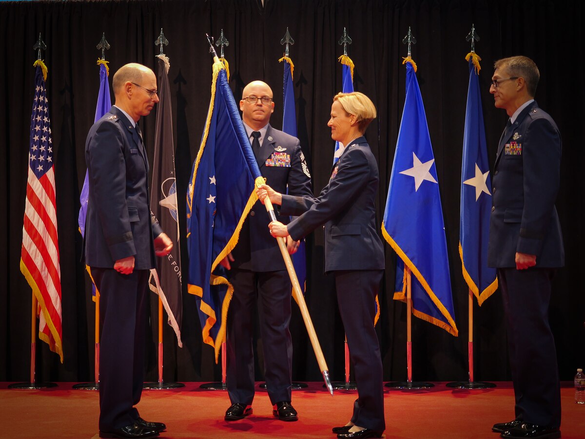 Maj. Gen. Heather L. Pringle, second from right, relinquishes command back to Gen. Duke Z. Richardson, left, commander, Air Force Materiel Command, during a change of command ceremony for the Air Force Research Laboratory, or AFRL, where Richardson then passes command to Brig. Gen. Scott A. Cain, far right, while Chief Master Sgt. Bill Fitch, AFRL command chief, stands center at the National Museum of the U.S Air Force, June 5, 2023. Cain thanked Pringle for her years of leadership and said he is honored to serve in the new role. He previously served as director of Air, Space and Cyberspace Operations at Headquarters, Air Force Materiel Command. (U.S. Air Force photo / Keith Lewis)