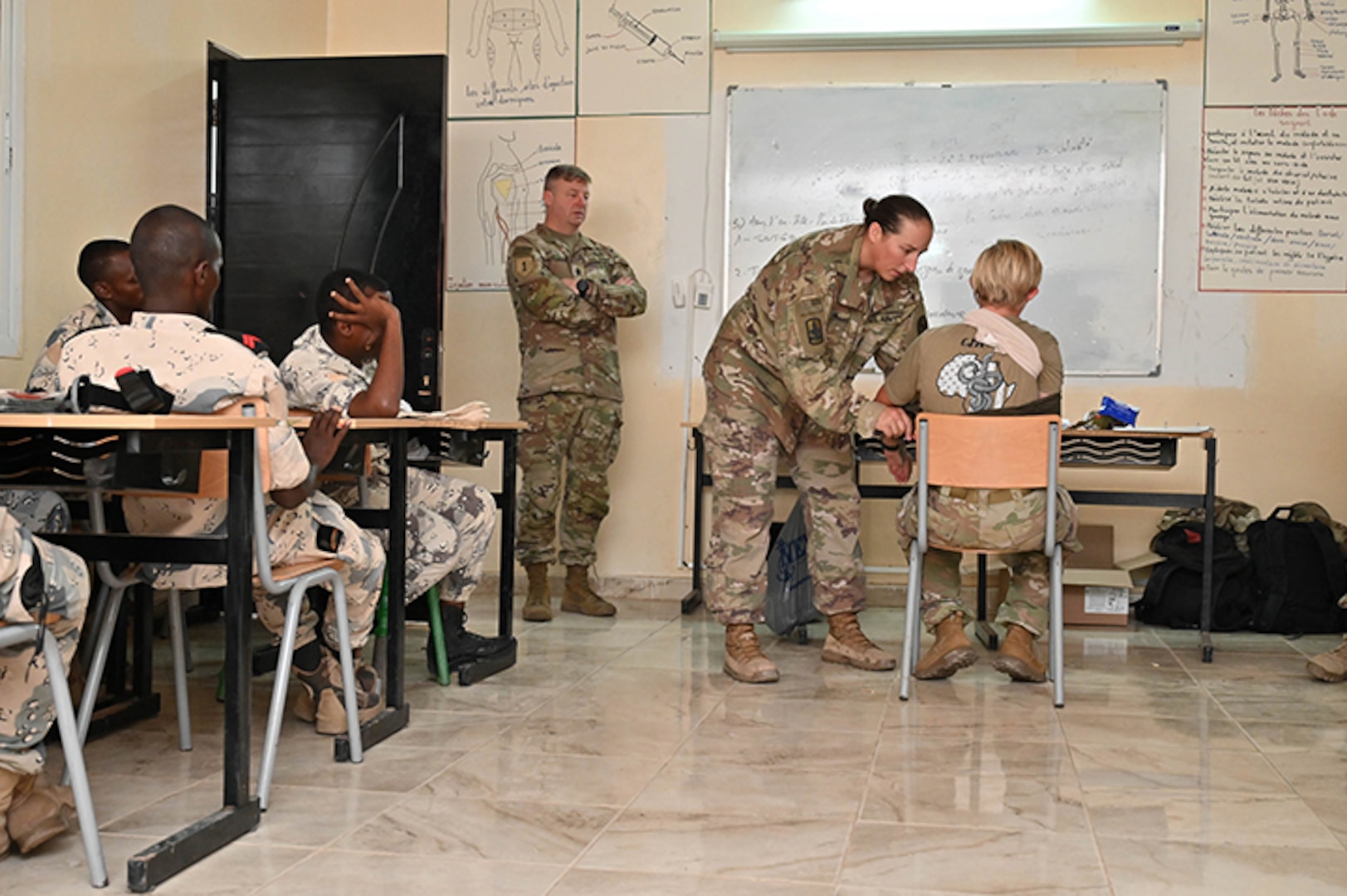 Command Sgt. Maj. Duane Weyer, the senior enlisted leader for the Wisconsin Army National Guard’s 157th Maneuver Enhancement Brigade currently deployed to Combined Joint Task Force-Horn of Africa, observes Sgt. 1st Class Heather Carr, CJTF-HOA surgeon cell senior enlisted leader