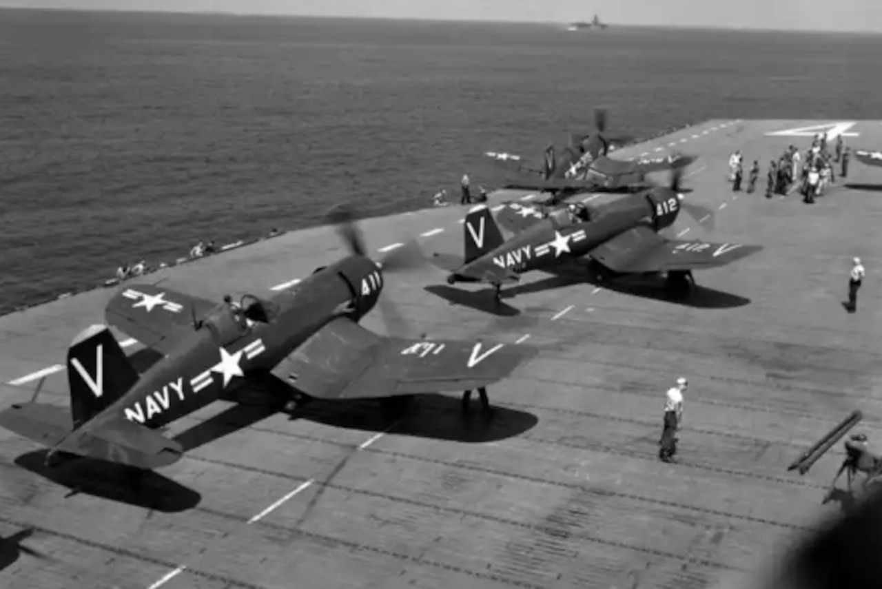 Military aircraft take off from the deck of a carrier.