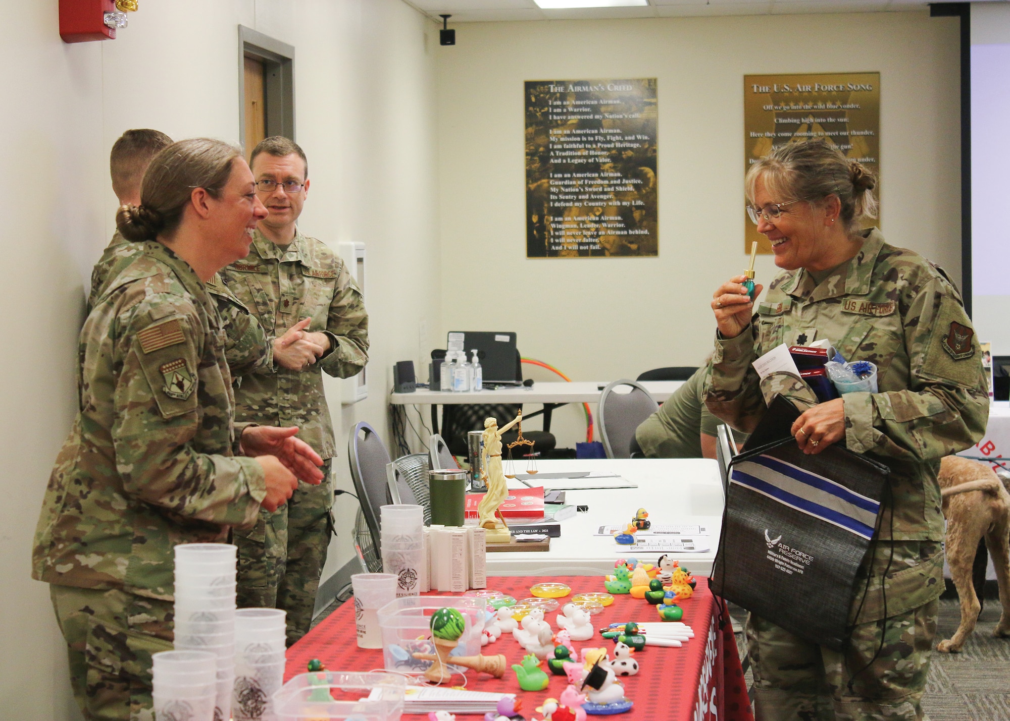 Lt. Col. Kimberly Ebel, 445th Aeromedical Staging Squadron flight chief administration services, smells calming oils at the Resilience table manned by Master Sgt. Rebeccah Stammen, 445th Airlift Wing first sergeant, during the wing’s 2nd Annual Wellness Fair at Wright-Patterson Air Force Base, May 7, 2023. Participating organizations included the American Red Cross, the Military & Family Readiness Center, the Key Spouses Program, Psychological Health programs, Veteran’s Affairs and 4 Paws for Ability.
