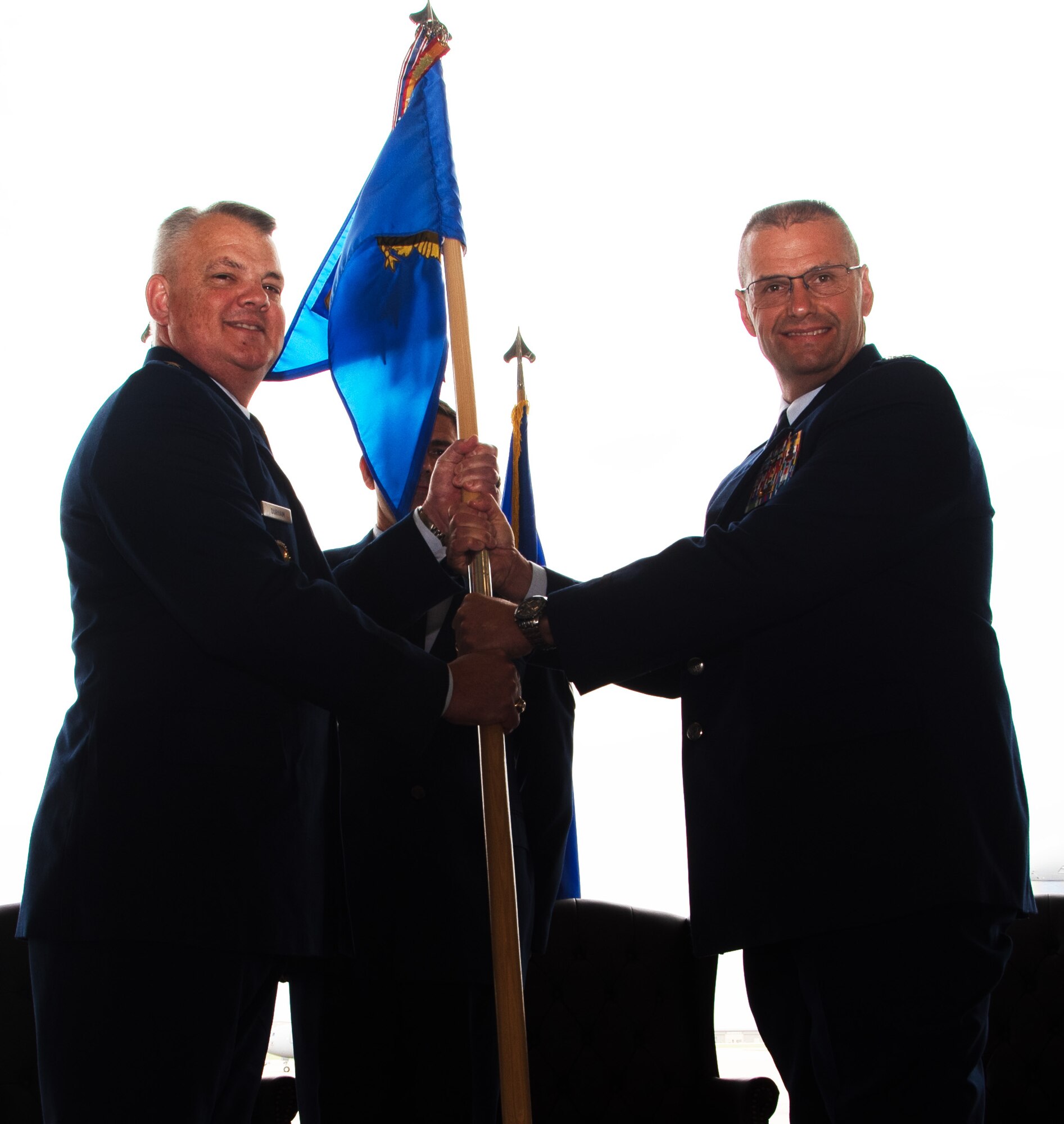 (Left to right) Brig. General D. Scott Durham takes the guideon to Col. Phil Heseltine, outgoing 931st Air Refueling Wing commander, during an official change of command ceremony June 3, 2023, McConnell Air Force Base, Kan.