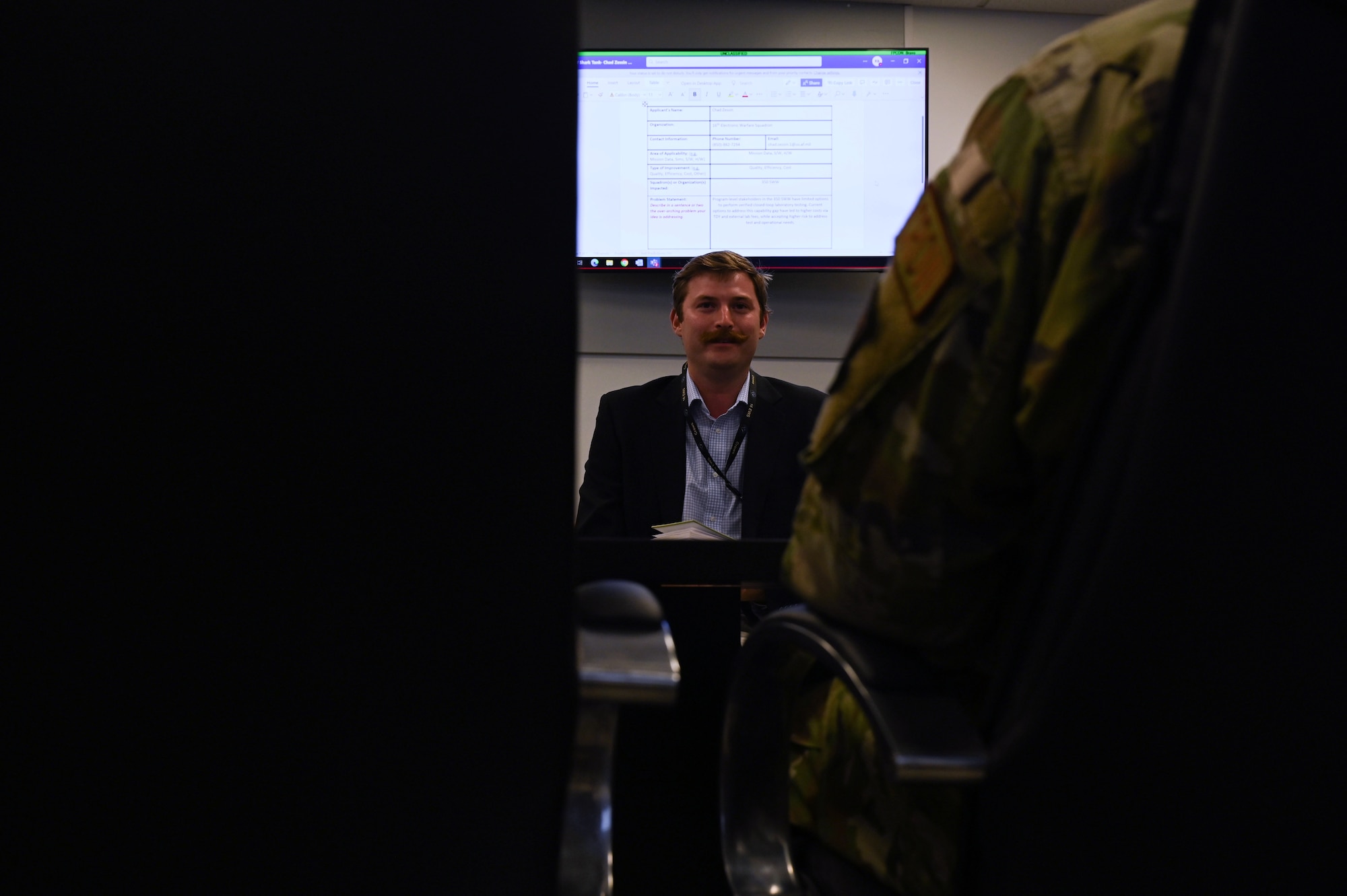 Chad Zessin, 16th Electronic Warfare Squadron mission data engineer, briefs during Shark Tank at Eglin Air Force Base, Fla., June 6, 2023. Shark Tank provides an opportunity for spectrum warfare professionals to think about innovative solutions to improve processes and enhance the impact on combat readiness throughout the wing (U.S. Air Force photo by Staff Sgt. Ericka A. Woolever)