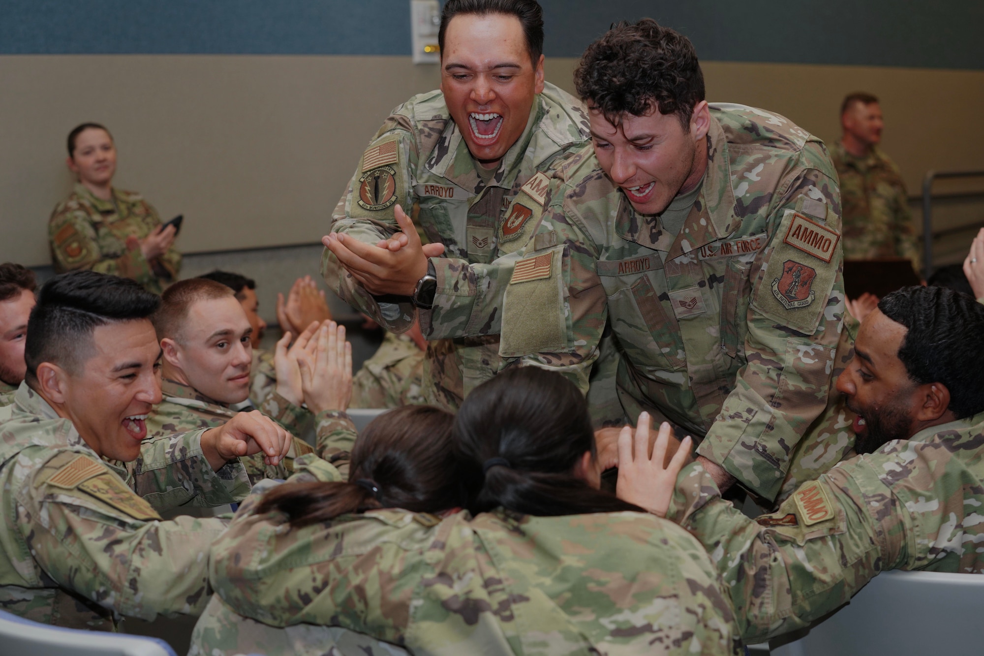 U.S. Air Force munitions Airmen congratulate student named the outstanding performer of the class April 21, 2023, at Beale Air Force Base, California.