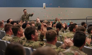 U.S. Air Force munitions Airmen celebrate during the Combat Ammunition Planning and Production course graduation April 21, 2023, at Beale Air Force Base, California.