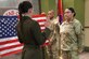 Army Capt. Joy R. Petway administers the Oath of Enlistment to Army Staff Sgt. Julie Charles at the 88th Readiness Division Headquarters, Fort McCoy, Wis., Nov. 22, 2022.