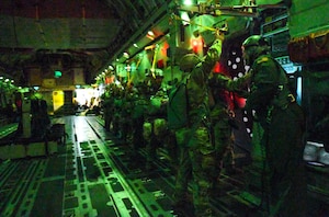 U.S. Army Soldiers from Fort Cavazos, Texas perform a static line drop from a C-17Globemaster III during a joint airborne air transportability training (JA/ATT) at Fort Cavazos June2, 2023.JAAT is critical to mission readiness because it simulates scenarios that would likely occur in actual combat.(U.S. Air Force photo illustration by Airman 1st Class Miyah Gray)
