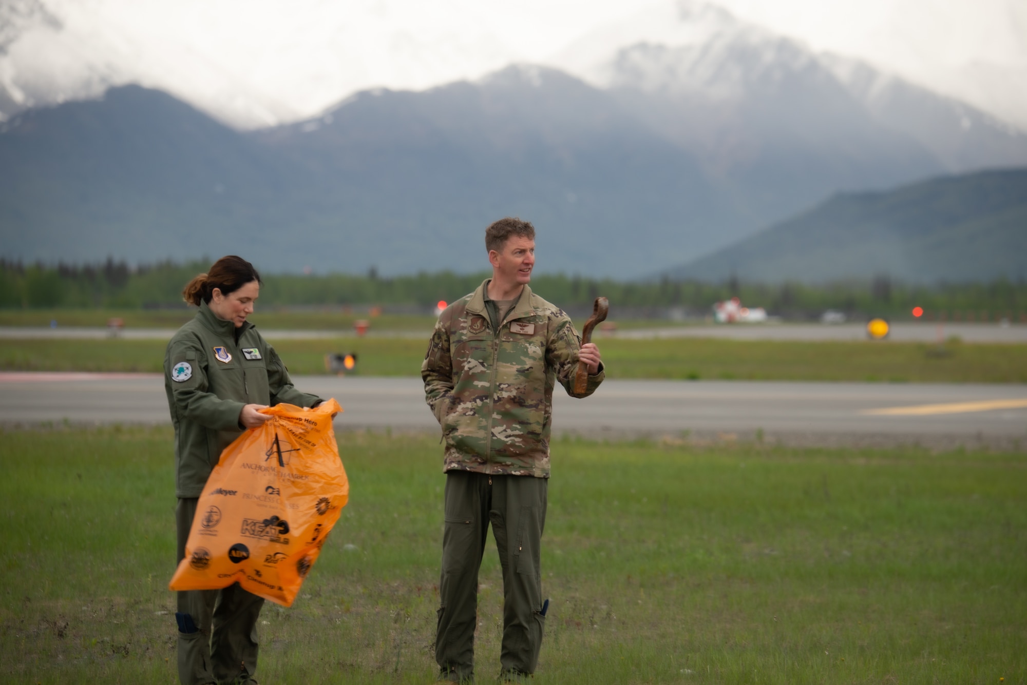 U.S. Airmen assigned to the 3rd Wing conduct a foreign object and debris walk at Joint Base Elmendorf-Richardson, Alaska, June 2, 2023. The Airmen conducted the FOD walk to remove debris that could potentially damage aircraft and hinder mission readiness.