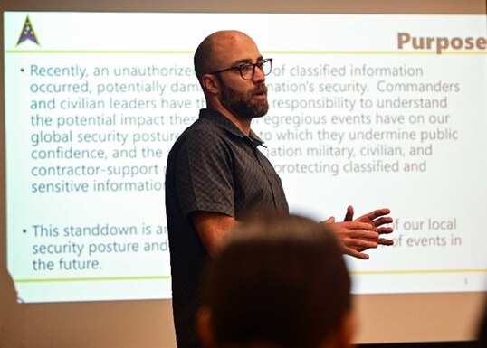 Cody Giboney, Space Launch Delta 30 Information protection chief, provides a briefing for a mandatory security stand-down ay at the SLD 30 Headquarters building on Vandenberg Space Force Base, Calif., May 12, 2023. The Secretary of the Air Force directed the stand down, with the aim of enhancing the understanding of every Airman and Guardians role in protecting classified and sensitive information. (U.S. Space Force photo by Airman 1st Class Ryan Quijas)
