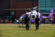 Nicole Hardie, a flight nurse, and Dr. Andy Celestia, a flight physician, walk from a LifeFlight helicopter at Naval Station Everett (NSE), June 6, 2023. NSE participated in a regional aircraft emergency response training exercise that includes aircraft and first responders from state, county, and local partner agencies in the Northwest Regional Aviation consortium. The training focuses on preparing for a potential real-world earthquake and tsunami disaster response. The exercise will help participating organizations, including the Navy, improve their ability to work together to support local emergency responders in a large-scale organized response. (U.S. Navy photo by Mass Communication Specialist 2nd Class Ethan Soto)