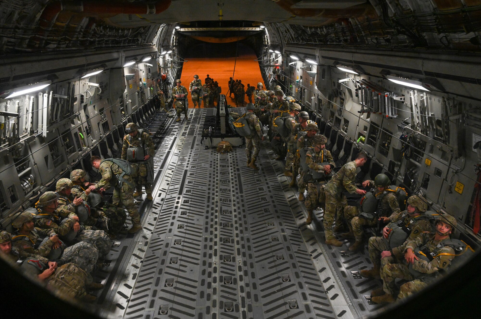 U.S. Army Soldiers from Fort Cavazos, Texas, board a C-17 Globemaster III at Fort Cavazos, Texas, June 2, 2023.Airmen from the 58th Airlift Squadron flew two C-17s to Fort Cavazos to transport 100 Soldiers to a drop zone and perform a static line drop of bundle packages and personnel. (U.S. Air Force photo by Airman 1st Class Miyah Gray)