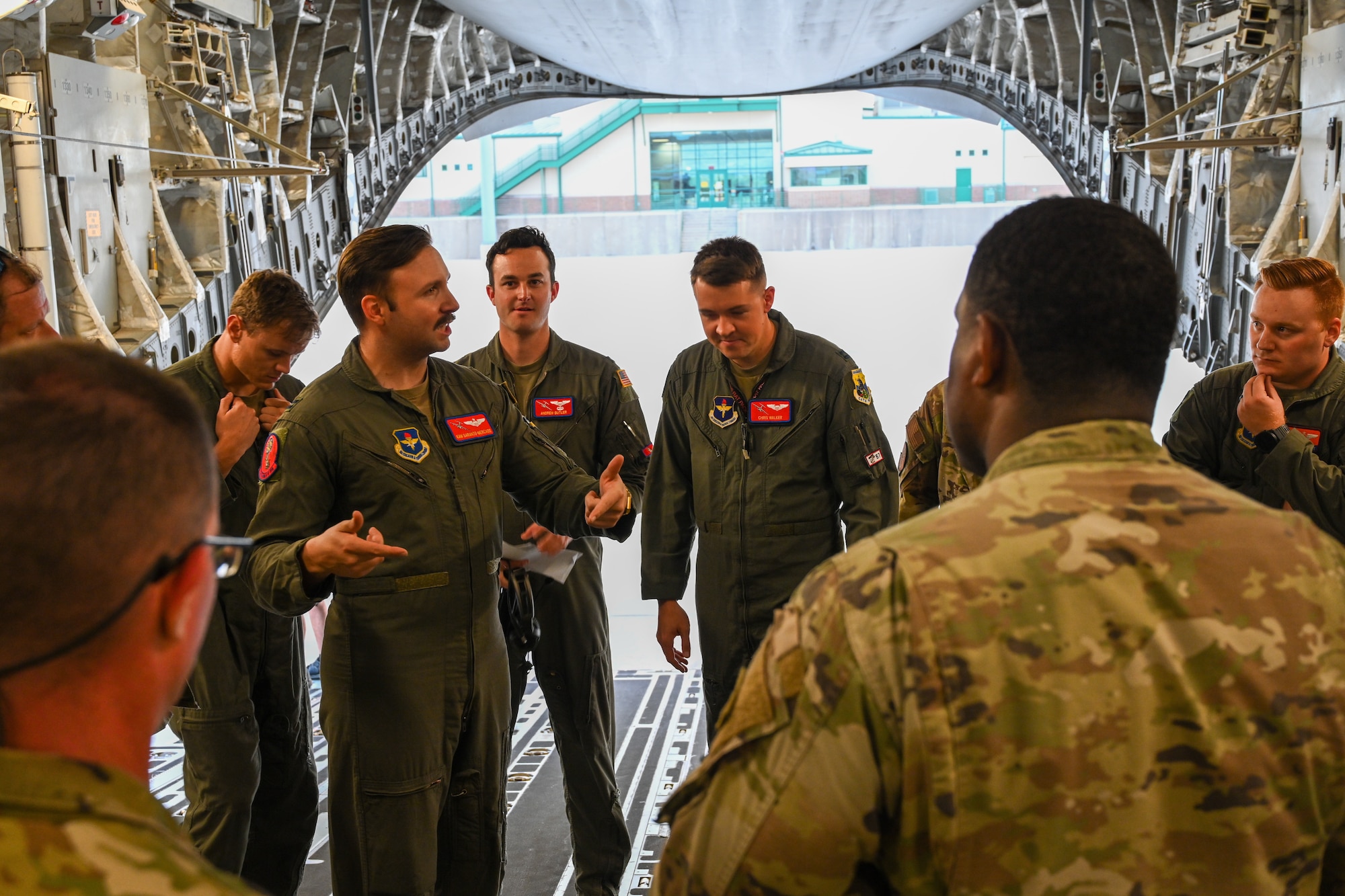 U.S. Air Force Capt. Kameron Sarantomercado, 58th Airlift Squadron instructor pilot, gives a brief prior to a training exercise at Fort Cavazos, Texas, June 2, 2023. The exercise provided an opportunity for Airmen and Soldiers to perform joint airborne air transportability training.(U.S. Air Force photo by Airman 1st Class Miyah Gray)