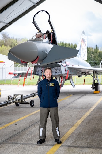 Caleb Wagner, a civilian engineer with the Air Force Life Cycle Management Center’s (AFLCMC) Life Sciences Equipment Laboratory, standing in front of a Eurofighter. Wagner is currently working with the German Air Force as part of a Engineer and Scientist Exchange Program. (Photo by Philipp Radetzki, German Air Force).