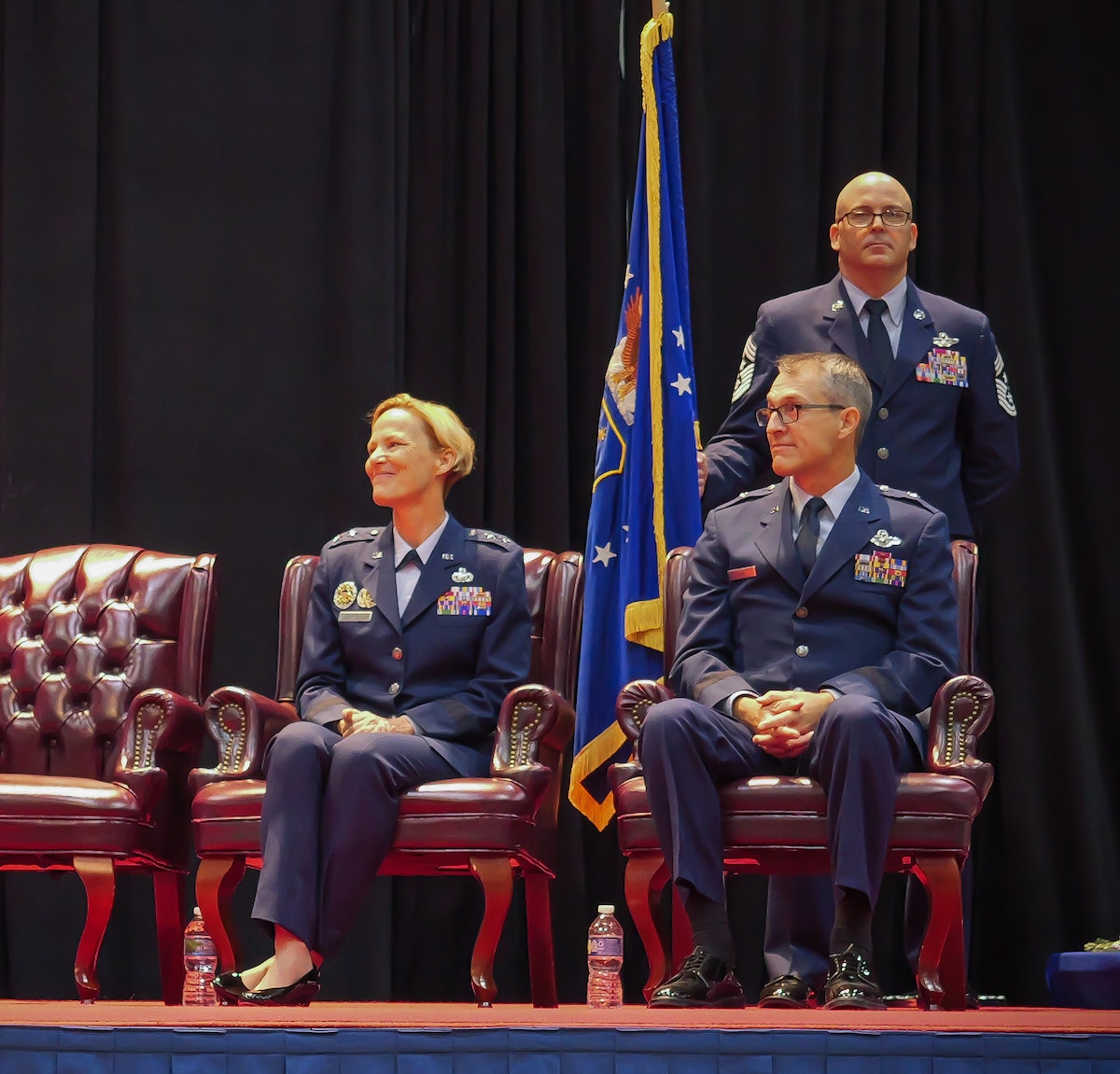 Maj. Gen. Heather L. Pringle, left, and Brig. Gen. Scott A. Cain, right, listen to remarks from Gen. Duke Z. Richardson, commander, Air Force Materiel Command, during a change of command ceremony for the Air Force Research Laboratory, or AFRL, where Pringle relinquishes command to Cain, while Chief Master Sgt. Bill Fitch, AFRL command chief, stands behind them at the National Museum of the U.S Air Force, June 5, 2023. Cain was chosen to be the 13th commander of AFRL and said he looks forward to the new position. He previously served as director of Air, Space and Cyberspace Operations at Headquarters, Air Force Materiel Command. (U.S. Air Force photo / Keith Lewis)
