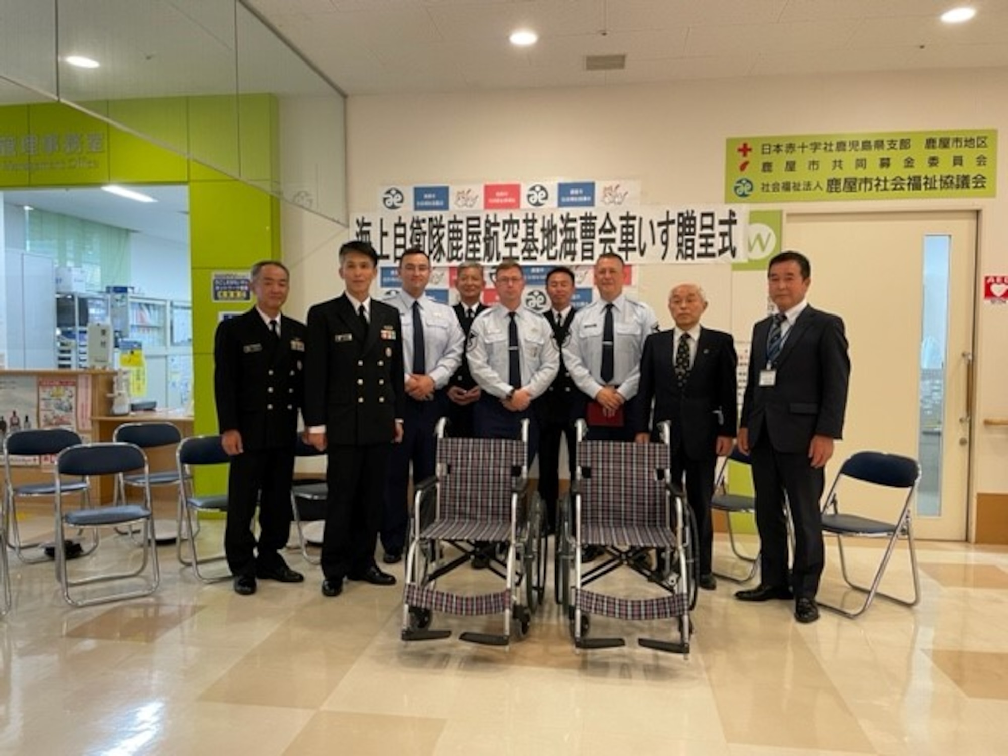 Members of the 319th Expeditionary Reconnaissance Squadron, Japan Maritime Self-Defense Force, and the Kanoya Welfare Association pose for a photo inside the Kanoya Welfare Association building. (Courtesy Photo)