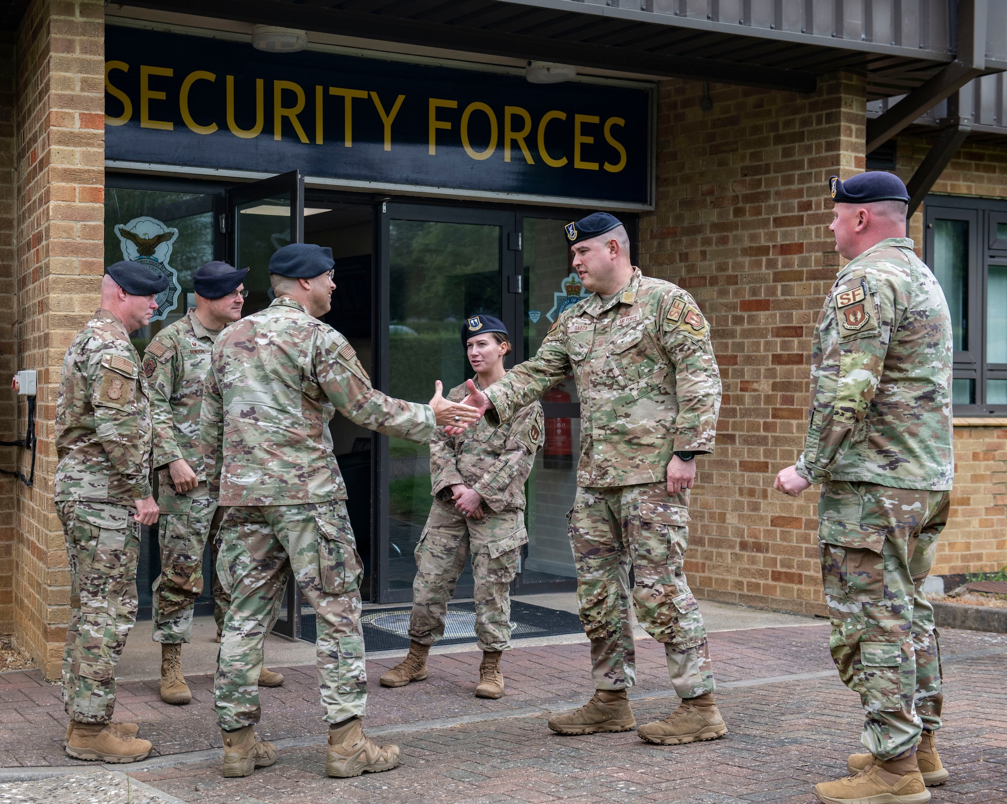 Members of the 422d Security Forces Squadron, right, greet Brig. Gen. Thomas Sherman, U.S. Air Force Headquarters director of security forces, and Chief Master Sgt. Donald Gallagher, U.S. Air Force Headquarters security forces career field manager, at RAF Croughton