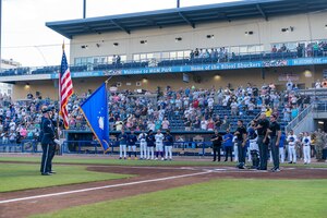 U.S. Air Force Staff Sgt. Dustin Hadsock, 81st SFS military working dog handler, Staff Sgt. Tessa Spare, 81st SFS MWD trainer, and Rico, 81st Security Forces Squadron MWD, perform a MWD demonstration at MGM Park, Biloxi, Mississippi, June 3, 2023.