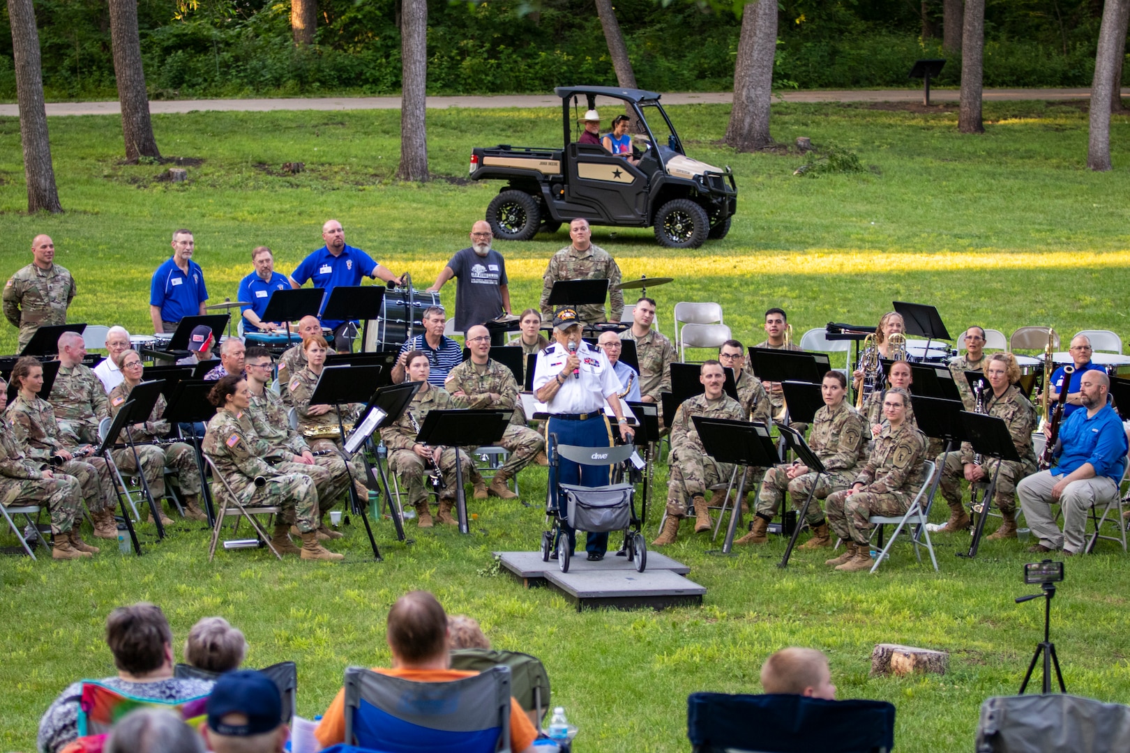Retired Chief Warrant Officer 4 William Splichal, 99-years-old, conducts the Nebraska National Guard's 43rd Army Band Soldiers and alumni through John Philip Sousa's Golden Jubilee, during a 75th anniversary concert, June 3, 2023, at the Wildewood Park in Ralston, Nebraska.