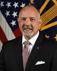 Mr. Charles L. Young III, Chief Counsel, National Guard Bureau, poses for his official portrait in the Army portrait studio at the Pentagon in Arlington, Va, Nov. 10, 2020.