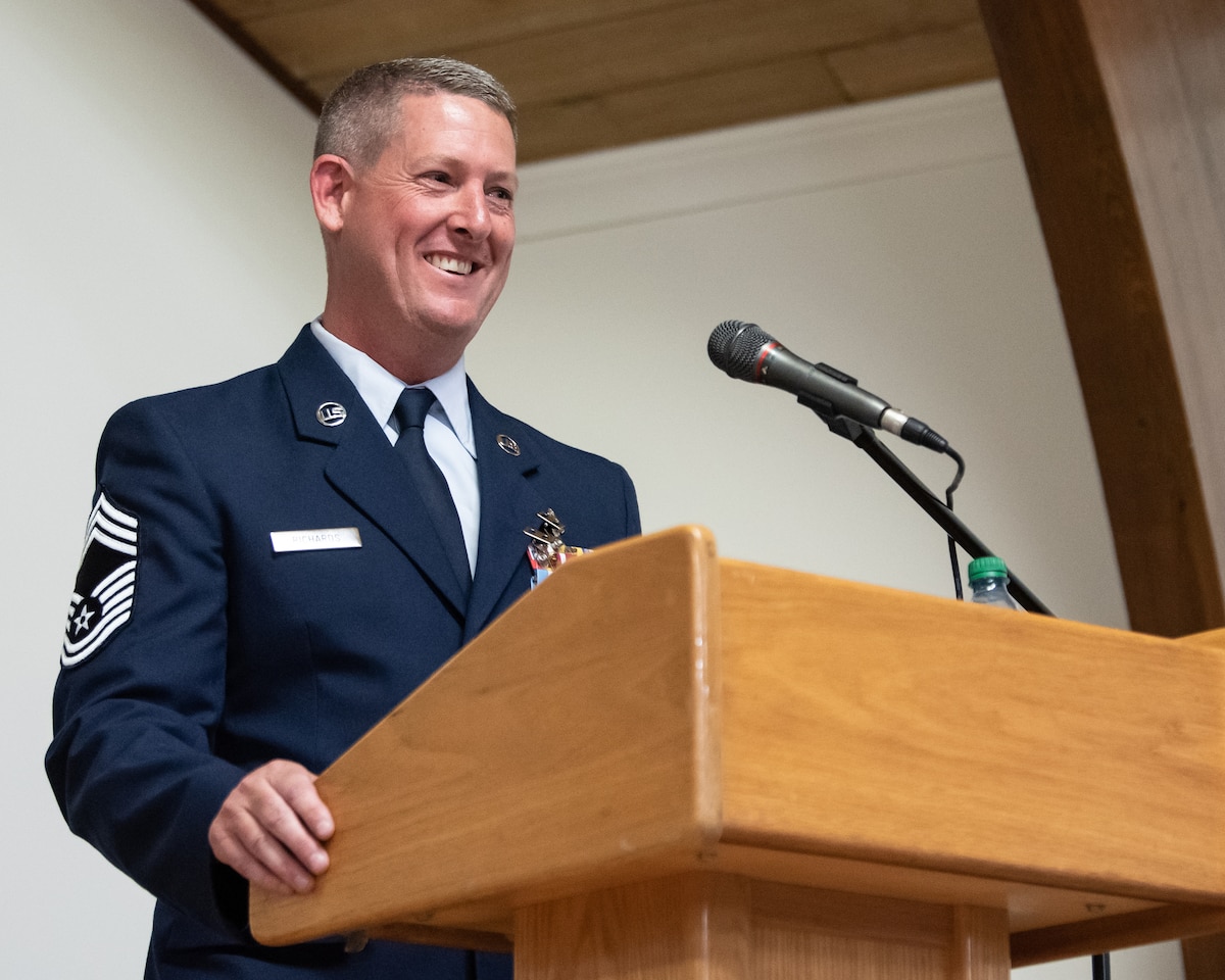 Chief Master Sgt. Kenneth Richards, senior enlisted leader of the 123rd Medical Group, addresses an audience of friends, family and fellow Airmen during his retirement ceremony at the Kentucky Air National Guard Base in Louisville, Ky., May 20, 2023. Richards is retiring after 30 years of service. (U.S. Air National Guard photo by Staff Sgt. Chloe Ochs)