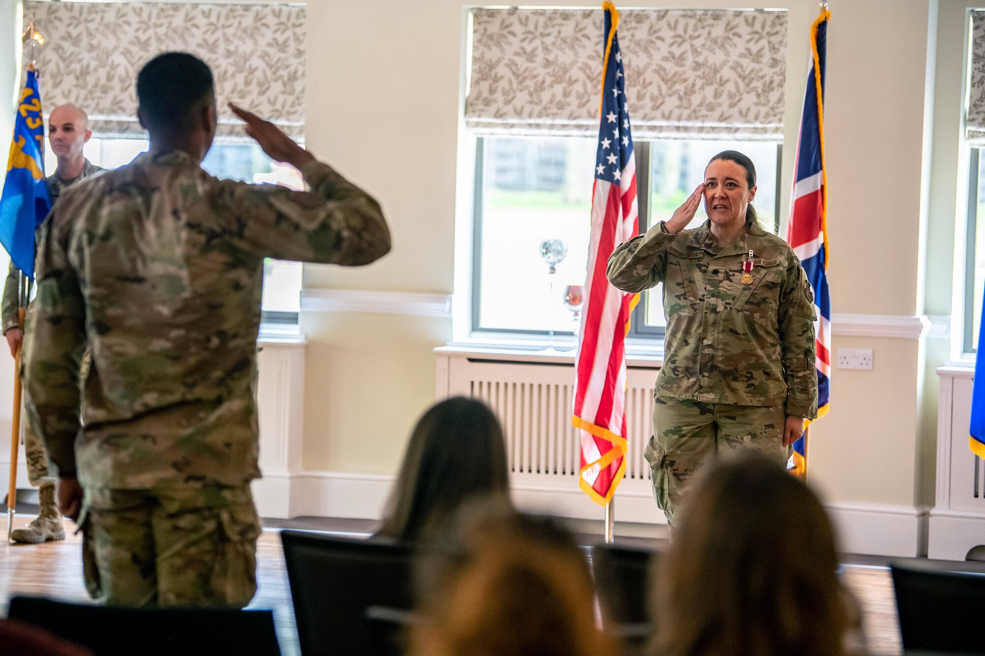 U.S. Air Force Lt. Col. Kirsten Nicholls, 423d Force Support Squadron outgoing commander, renders a final salute to an Airman from the 423d FSS during a change of command ceremony at RAF Alconbury, England, June 5, 2023. During her command, Nicholls implemented quality of life programs for 32 facilities across two installations. Her activities also served 12 joint force and multi-national mission partners. (U.S. Air Force photo by Staff Sgt. Eugene Oliver)