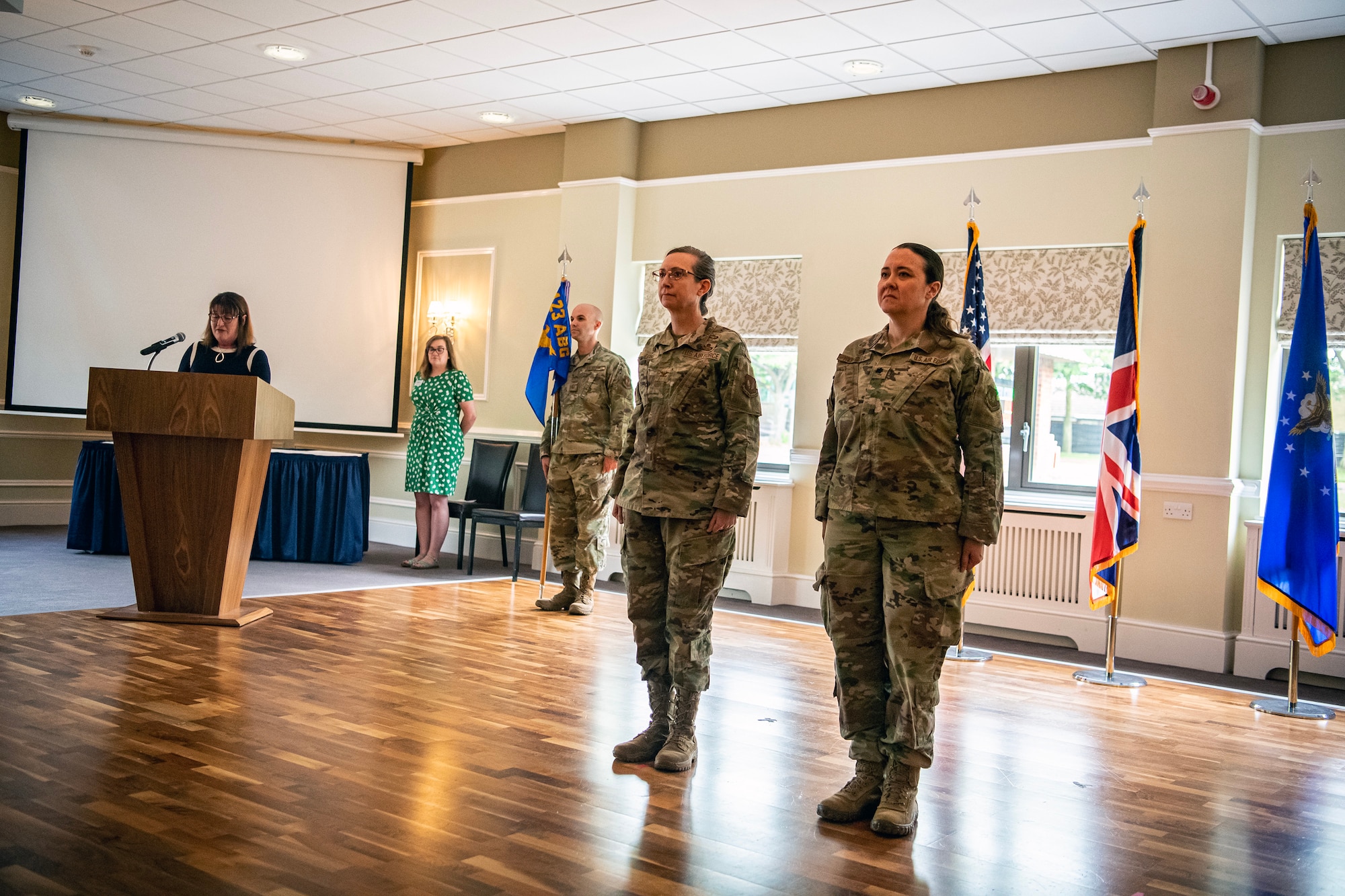 Airmen from the 501st Combat Support Wing stand at attention during a decoration reading at RAF Alconbury, England, June 5, 2023. The decoration was read as part of the 423d Force Support Squadron change of command ceremony, where Lt. Col. Kirsten Nicholls relinquished command of the 423d FSS to Maj. Roy Surita. (U.S. Air Force photo by Staff Sgt. Eugene Oliver)