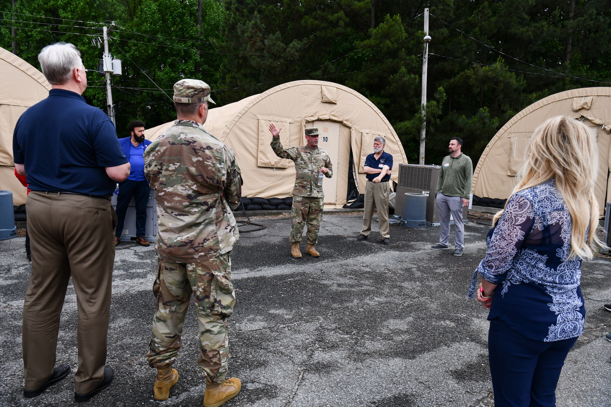 Chief Master Sgt. Bryon Godwin, force support silver flag superintendent assigned to the 622nd Training Squadron, explains the deployed military living environment to participants of the 910th Airlift Wing’s civic leader tour to Dobbins Air Reserve Base, Georgia, May 12, 2023.