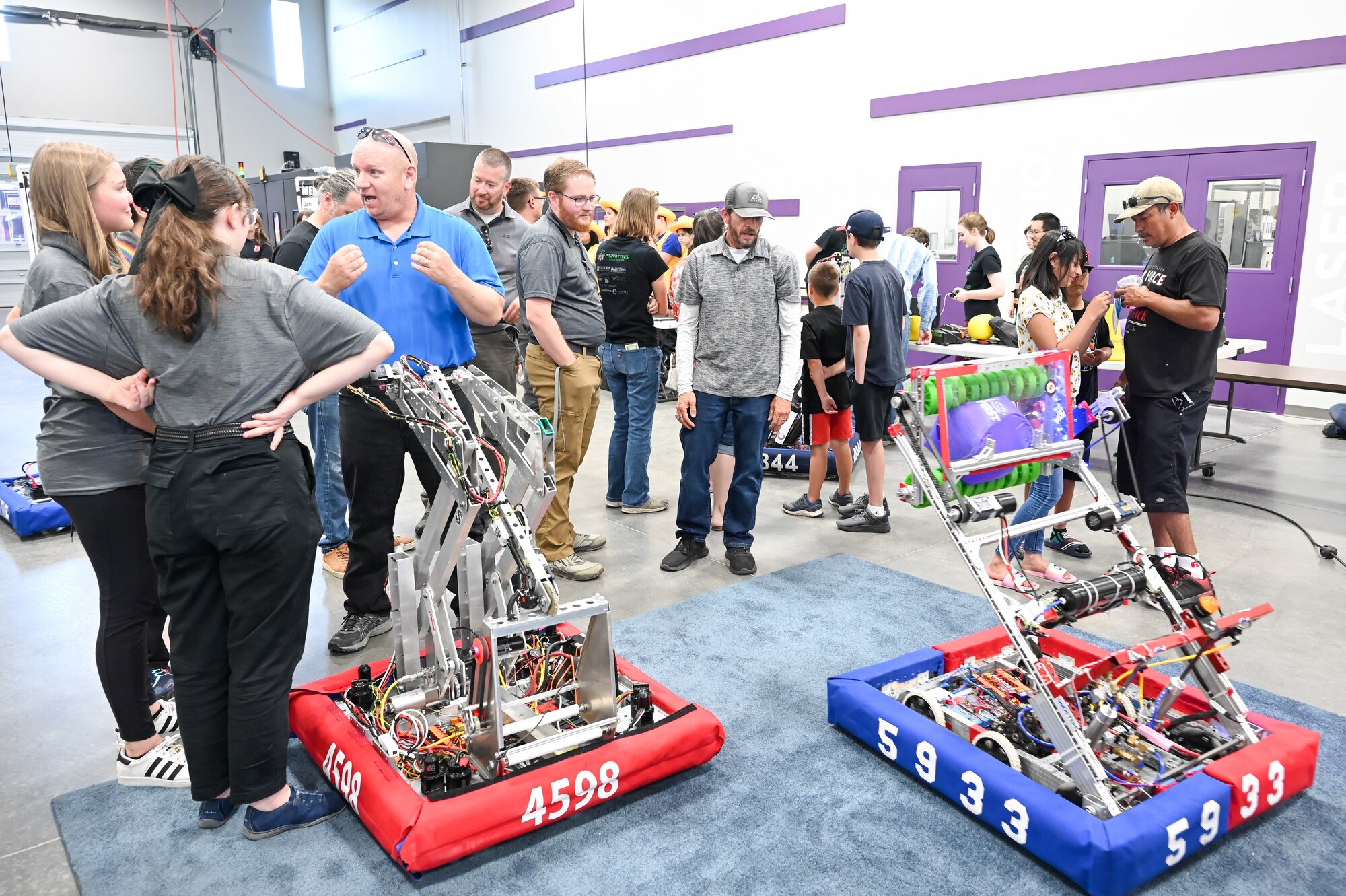 Youth teams from FIRST Robotics demonstrate and share information on designing, programming, testing, and competing with their robots June 1, 2023, to employees from Hill Air Force Base, Utah, during a lunch and learn open house event. Hill’s STEM Outreach program sponsored the event with FIRST, which is a robotics community that prepares young people for the future through a suite of inclusive, team-based robotics programs. (U.S. Air Force photo by Cynthia Griggs)