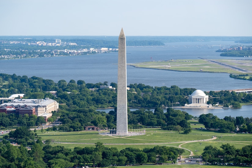 An aerial view of the Washington Monument and nearby buildings.