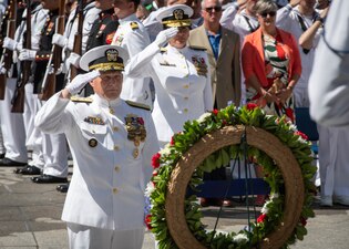 CNO Adm. Michael Gilday salutes a wreath commemorating the 81st anniversary of the Battle of Midway.