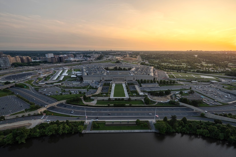 An aerial photo of the Pentagon and surrounding buildings as the sun sets.