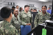 U.S. Navy Sailors attached to USS Fitzgerald (DDG 62), including (from left) Chief Petty Officer Nelli Gray-Diaz, Chief Petty Officer Clarissa Moore, Ensign Alexander Cruz, and Ensign Ariana McKenzie, speak about the Integrated Bridge Navigation System (IBNS) at Naval Surface Warfare Center, Philadelphia Division (NSWCPD) on May 15, 2023. (U.S. Navy photo by Sgt. Jermaine Sullivan/Released)