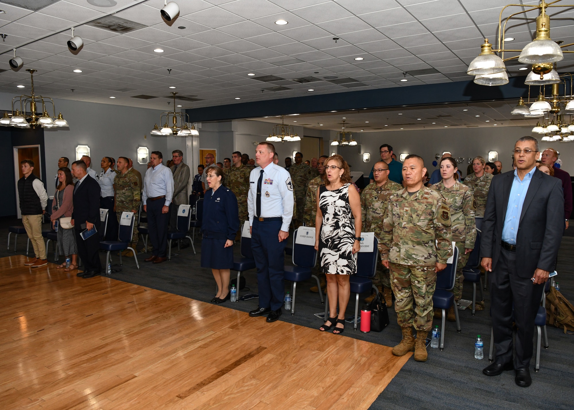 Friends, family, distinguished visitors and fellow Reserve recruiting Airmen sing the Air Force song at the conclusion of the 367th Recruiting Group assumption of command ceremony.