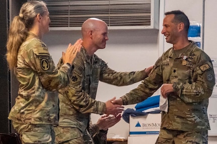 Lt. Col. Brent Weece, commander, Task Force Tomahawk, shakes hands with the commander of Task Force Wolfhound, New York National Guard, during the transfer of authority ceremony between the two units at Camp Lemonnier, Djibouti, June 3, 2023. (photo provided by Combined Joint Task Force-Horn of Africa)
