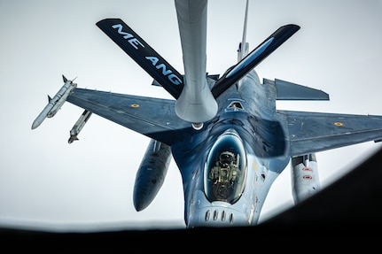 A Belgium F-16 maneuvers to receive more fuel midair from a KC-135 Stratotanker over the Arctic Circle, June 7, 2023. The 101st Air Refueling Wing is taking part in Arctic Challenge Exercise 2023, a live fly exercise that serves to advance arctic security initiatives and enhance interoperability in the increasingly dynamic and contested region.