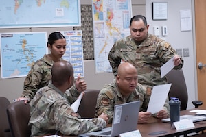 Airmen having discussion in a classroom