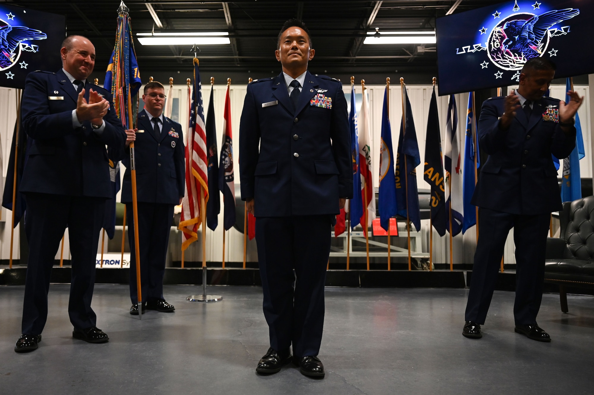 U.S. Air Force Col. Robert P. Cocke, 350th Spectrum Warfare Group commander, stands at attention as during a change of command at Eglin Air Force Base, June 6, 2023. The mission of the 16th EWS is to develop, test, validate, and field electromagnetic warfare capabilities for the warfighter. (U.S. Air Force photo by Staff Sgt. Ericka A. Woolever)