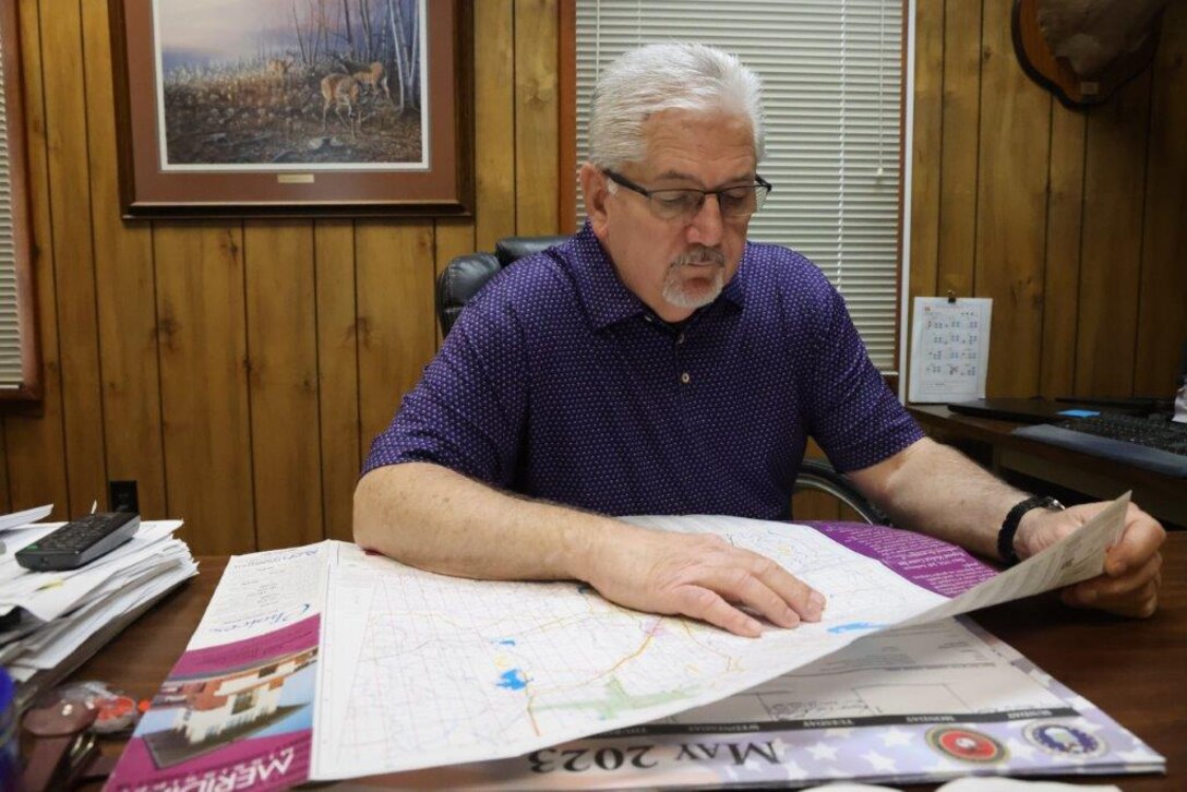 Mark Dean, Operations Project Manager, reviews a map of Okatibbee Lake in his office in Okatibbee Lake, Mississippi, May 31, 2023. Dean, who grew up near the lake and has worked for the U.S. Army Corps of Engineers and at the lake since 1985, became Project Manager in 2012.