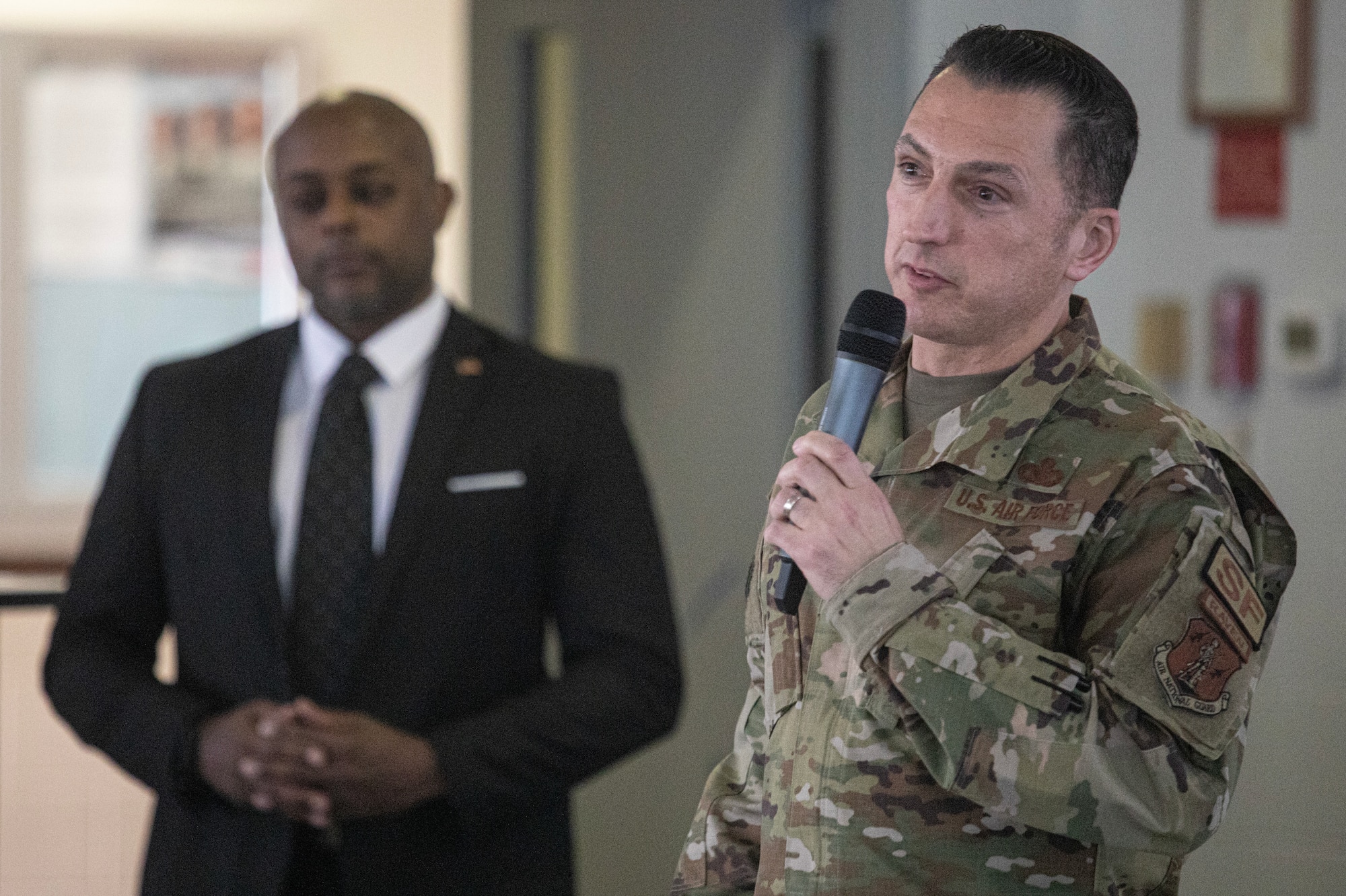 New Jersey State Command Chief Master Sgt. Michael Rakauckas introduces guest speaker Corey Jones during the 5th Annual O-6/E-9 Summit held at the 177th Fighter Wing on Atlantic City Air National Guard Base, New Jersey, June 7, 2023.