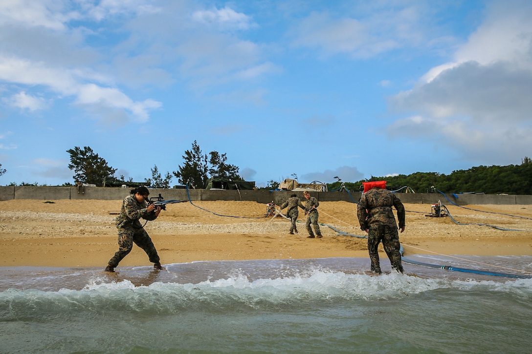 U.S. Marine Corps Lance Cpl. Alpha Hernandez, combat videographer with Communication Strategy and Operations, 3d Marine Logistics Group, documents water support technicians pumping ocean water to purify it into drinkable water during exercise Pacific Pioneer, Okinawa, Japan, April 21, 2021. Pacific Pioneer serves as 9th ESB's Marine Corps Combat Readiness Evaluation as well as an opportunity to demonstrate the ability to establish and sustain expeditionary advanced bases with survivable force protection, practice naval integration, and position long range precision fires and tactical logistics nodes across littoral regions in support of naval operations. 3d MLG, based out of Okinawa, Japan, is a forward deployed combat unit that serves as III MEF’s comprehensive logistics and combat service support backbone for operations throughout the Indo-Pacific area of responsibility. Hernandez is a native of Houston, Texas. (U.S. Marine Corps photo by Sgt. Hailey D. Clay)