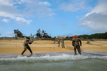 U.S. Marine Corps Lance Cpl. Alpha Hernandez, combat videographer with Communication Strategy and Operations, 3d Marine Logistics Group, documents water support technicians pumping ocean water to purify it into drinkable water during exercise Pacific Pioneer, Okinawa, Japan, April 21, 2021. Pacific Pioneer serves as 9th ESB's Marine Corps Combat Readiness Evaluation as well as an opportunity to demonstrate the ability to establish and sustain expeditionary advanced bases with survivable force protection, practice naval integration, and position long range precision fires and tactical logistics nodes across littoral regions in support of naval operations. 3d MLG, based out of Okinawa, Japan, is a forward deployed combat unit that serves as III MEF’s comprehensive logistics and combat service support backbone for operations throughout the Indo-Pacific area of responsibility. Hernandez is a native of Houston, Texas. (U.S. Marine Corps photo by Sgt. Hailey D. Clay)
