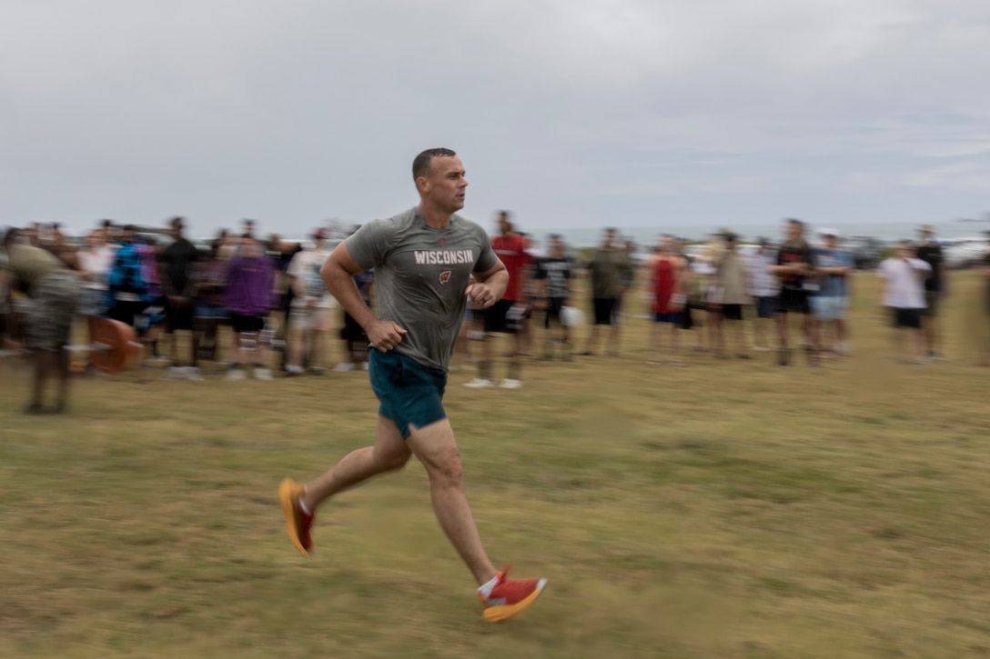 U.S. Marines with Headquarters Battalion, Marine Corps Base Hawaii, compete in a deadlift competition during the Headquarters Battalion Beach Bash, MCBH, June 1, 2023. Headquarters Company and Service Company competed in various team-building activities which aimed to foster unit cohesion and esprit de corps. (U.S. Marine Corps photo by Lance Cpl. Hunter Jones)